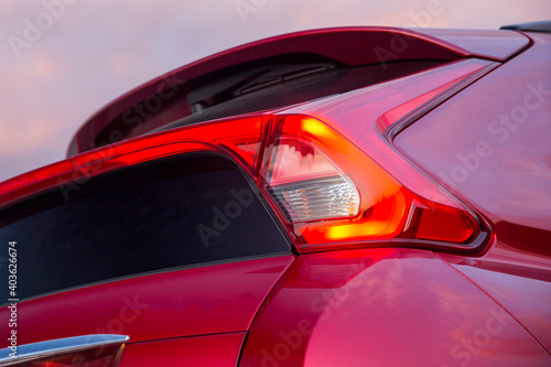 Close-up  car rear tail-lamp with a brakelight stop signal. © artographer34