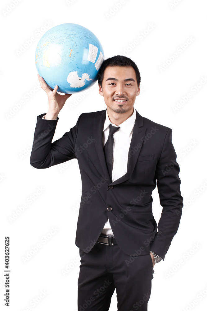 A young business man holding terrestrial globe A young business man holding terrestrial globe