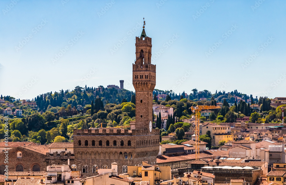 Great panoramic view overlooking the historic centre of Florence with a close-up of the popular Palazzo Vecchio with the Arnolfo Tower, seen from the famous Giotto's campanile on a sunny day.