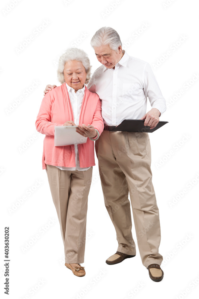 The happy old senior couple holding book The happy old senior couple holding book