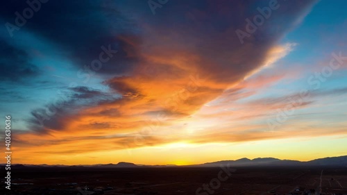 Fiery red and orange sunrise timelapse in cloudy Mojave Desert
