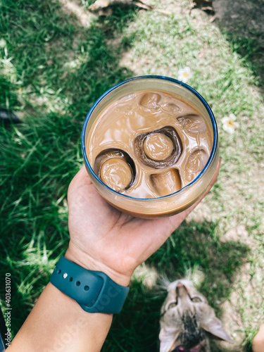person holding a tin can