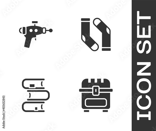 Set Antique treasure chest, Ray gun, Book and Socks icon. Vector.