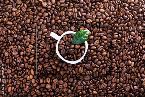 Fototapeta Naklejka Na Ścianę i Meble -  White cup on Roasted beans background with geometric frame