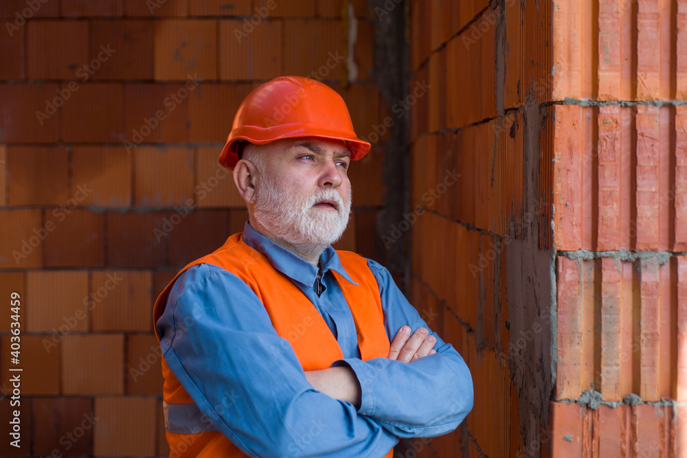 Builder man. Portrait of confident professional old workman. New home, renovation concept. Builder man. Portrait of confident professional old workman. New home, renovation concept.