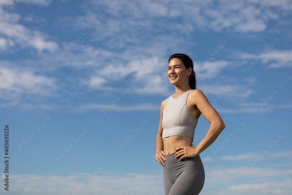 Asian-American woman takes a break from practicing Yoga outside in park - 0140 Asian-American woman takes a break from practicing Yoga outside in park - 0140