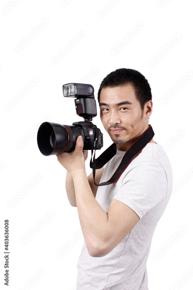 A young male photographer with a camera A young male photographer with a camera