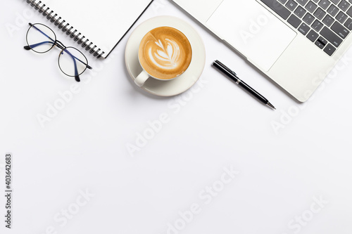 Top view, Workspace desk With coffee and office supplies on white background