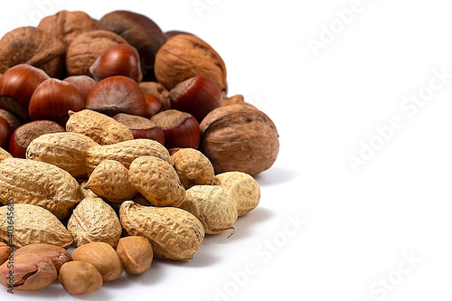Assortment of nuts in shell, on white background, no people,