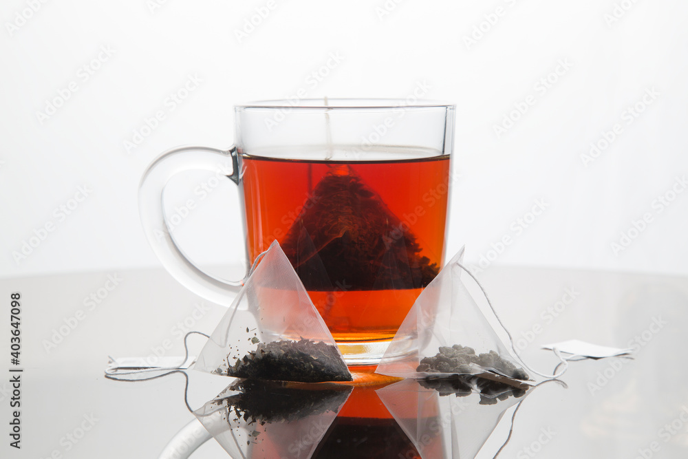 Pyramid-shaped tea bags.Homemade tea party. Pyramid-shaped tea bags.Homemade tea party.