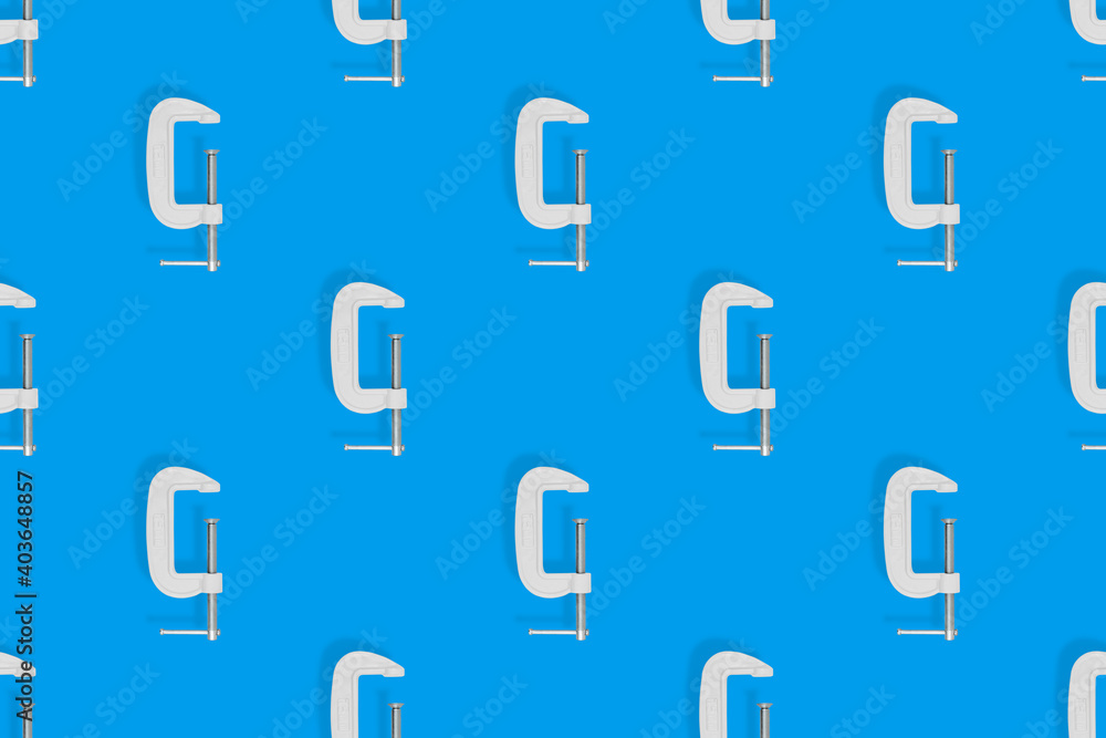 Clamp seamless pattern. Pattern of metal clamp on a blue background. Clamp seamless pattern. Pattern of metal clamp on a blue background.