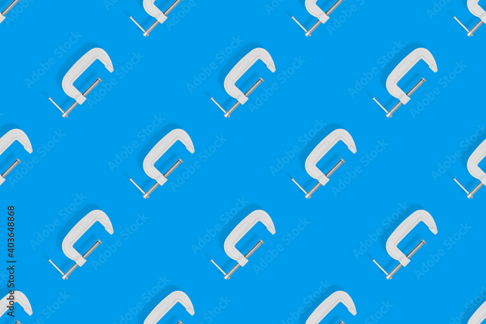 Clamp seamless pattern. Pattern of metal clamp on a blue background. Clamp seamless pattern. Pattern of metal clamp on a blue background.