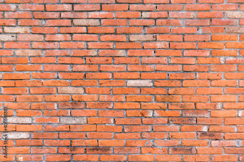 Orange color brick wall for brickwork background design