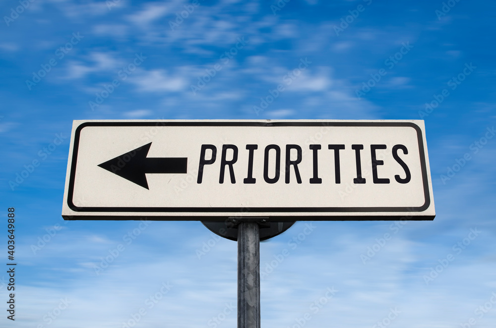 Priorities road sign, arrow on blue sky background. One way blank road sign with copy space. Arrow on a pole pointing in one direction. Priorities road sign, arrow on blue sky background. One way blank road sign with copy space. Arrow on a pole pointing in one direction.