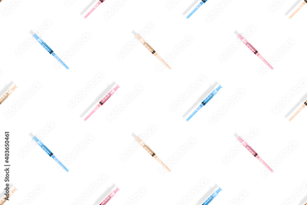 Medical syringes seamless pattern. Multi-colored medical syringes on a white background.