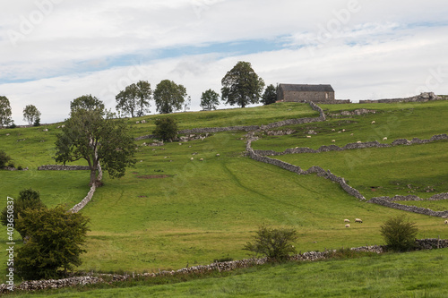 Barn In The Landscape / An image of a traditional English style barn in the hills of Derbyshire, England, UK.