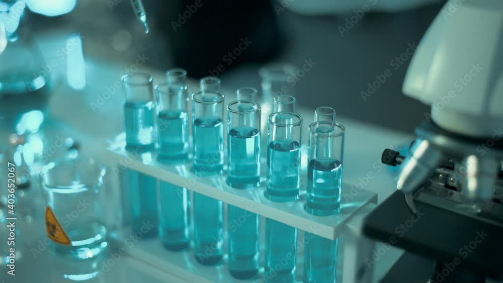 Scientists is testing for Covid-19 By using science tubes to research in a laboratory . Scientists is testing for Covid-19 By using science tubes to research in a laboratory .