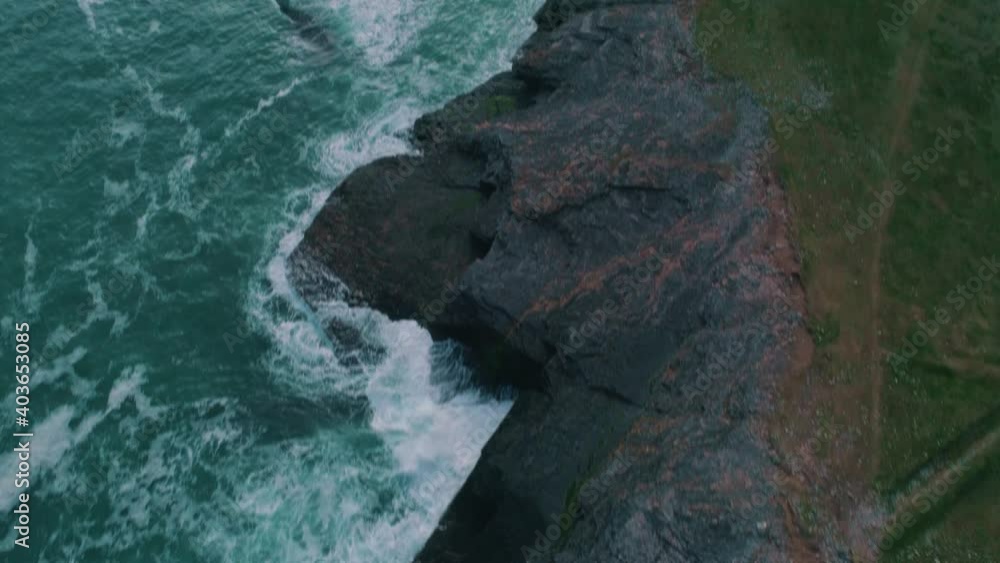 Lighthouse along a cliff aerial Lighthouse along a cliff aerial