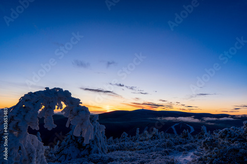 Fantastic morning landscape glowing by sunlight. Dramatic wintry scene. Natural park. Jeseniky czech  Europe. Beauty world. Sunrise in winter mountain