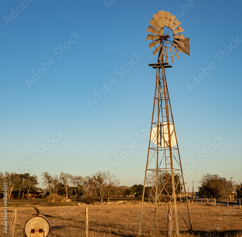 Windmill at the edge of a farm in Shiner, TX