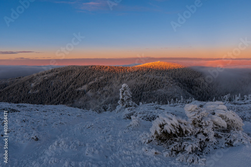 Fantastic morning landscape glowing by sunlight. Dramatic wintry scene. Natural park. Jeseniky czech, Europe. Beauty world. Sunrise in winter mountain