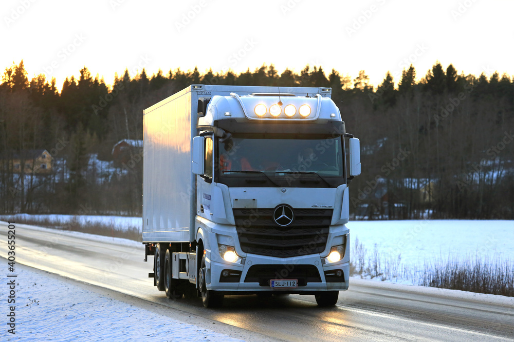 White Mercedes-Benz Actros Trucking at Winter Sunset Stock Photo | Adobe  Stock
