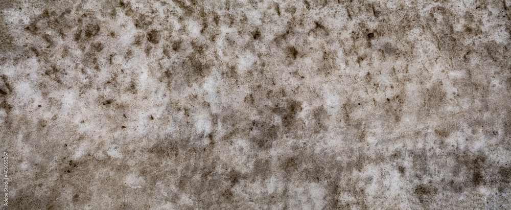 Badly stained texture on the snowy road Badly stained texture on the snowy road