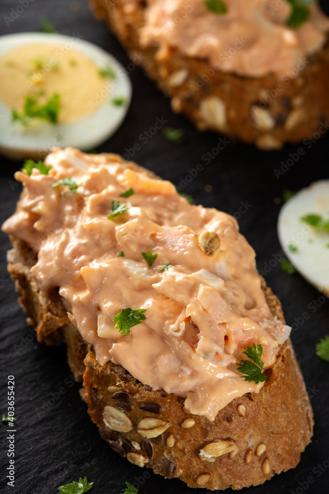Salmon salad on bread with herbs Salmon salad on bread with herbs