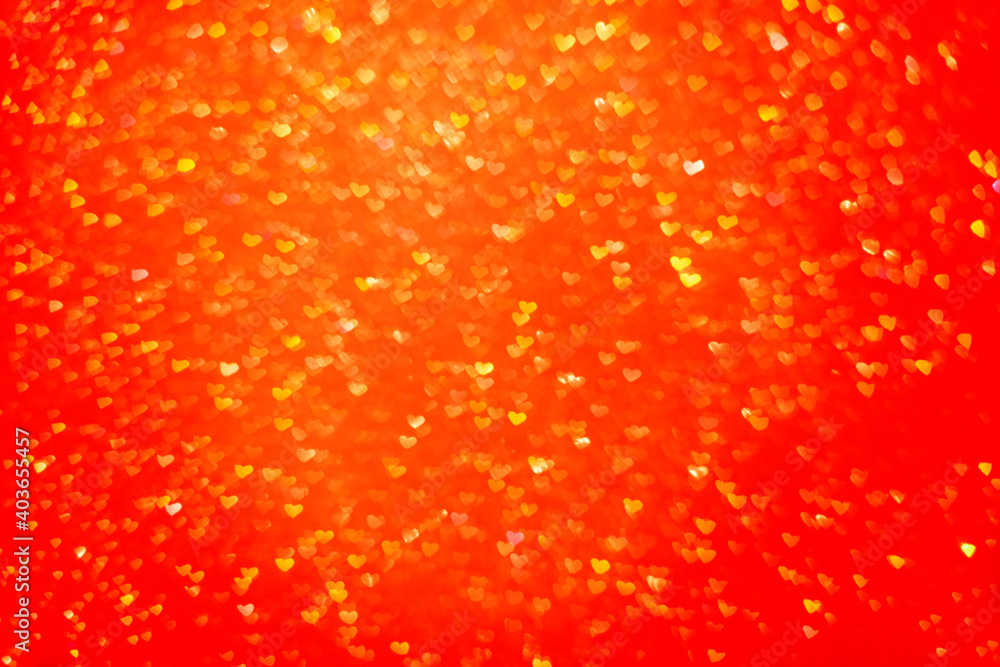 Blurred out of focus bokeh background. Texture from red orange hearts. Preparation for a holiday greeting card. Abstract valentines day, festive love. Place for text, copy space. Pattern sunset of sun Blurred out of focus bokeh background. Texture from red orange hearts. Preparation for a holiday greeting card. Abstract valentines day, festive love. Place for text, copy space. Pattern sunset of sun
