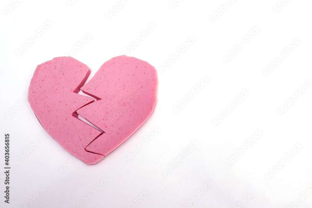 Heart-shaped sausage on a white background.