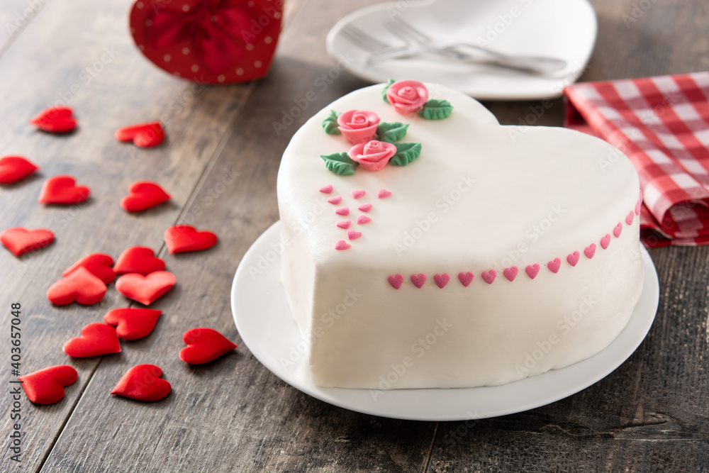 Heart cake for St. Valentine's Day, Mother's Day, or Birthday, decorated with roses and pink sugar hearts Heart cake for St. Valentine's Day, Mother's Day, or Birthday, decorated with roses and pink sugar hearts