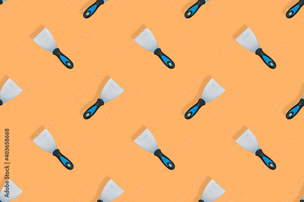 Putty trowel seamless pattern. Spatulas for on an orange background. Putty trowel seamless pattern. Spatulas for on an orange background.