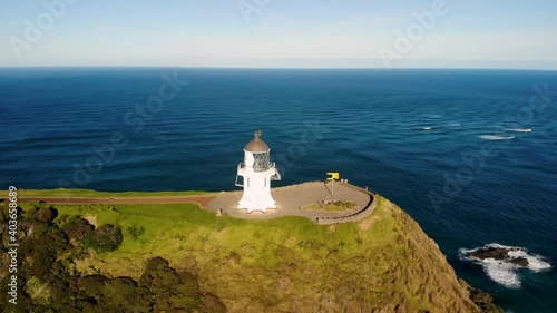 Spectacular Lighthouse aerial look up. Cape Reinga,  New Zealand. Pacific Ocean on horizon. photo