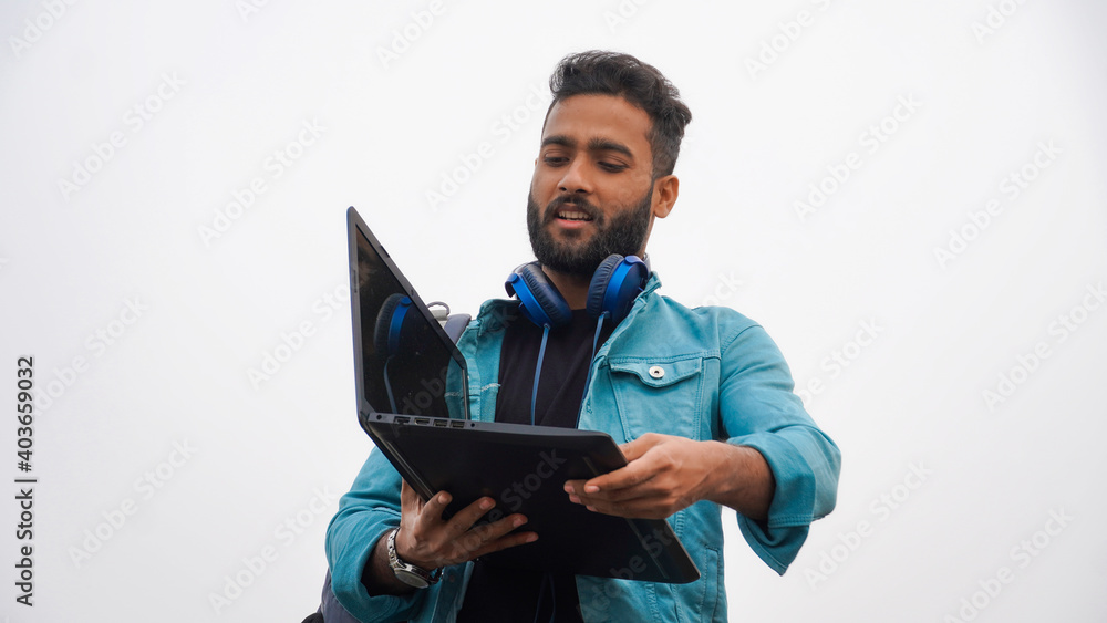 Young man with laptop and headphone