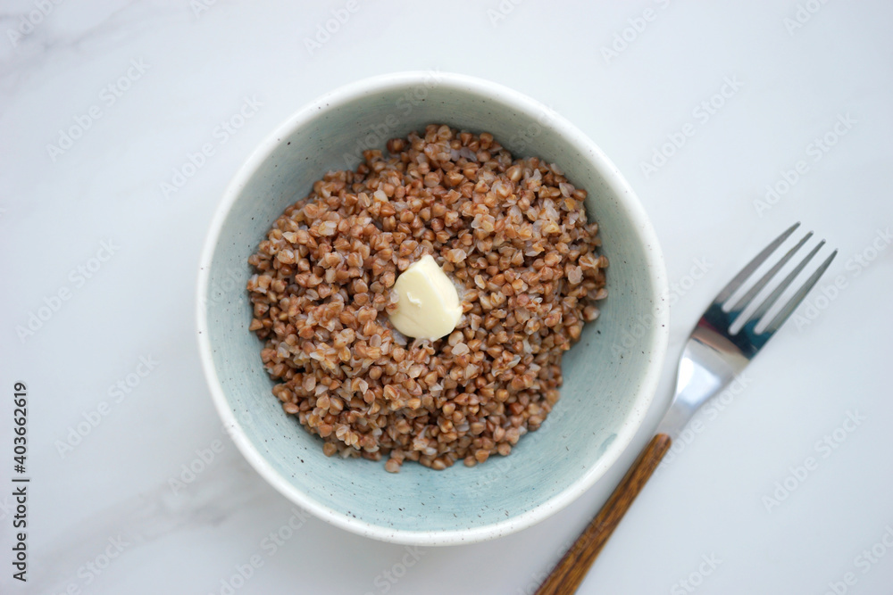 Buckwheat with butter in a small bowl Buckwheat with butter in a small bowl