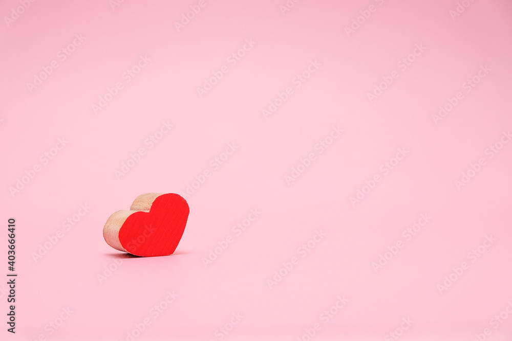 Valentines Day background with red wood heart on pink background. February 14 greeting card Valentines Day background with red wood heart on pink background. February 14 greeting card