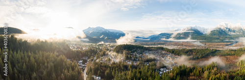 Aerial Panoramic View of Residential Homes in a touristic city. Colorful Sunrise Sky. Taken in Squamish, North of Vancouver, British Columbia, Canada.