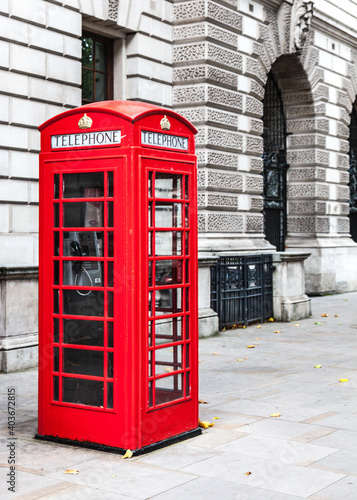 Iconic British red telephone box on the streets of Westminster in the City Of London