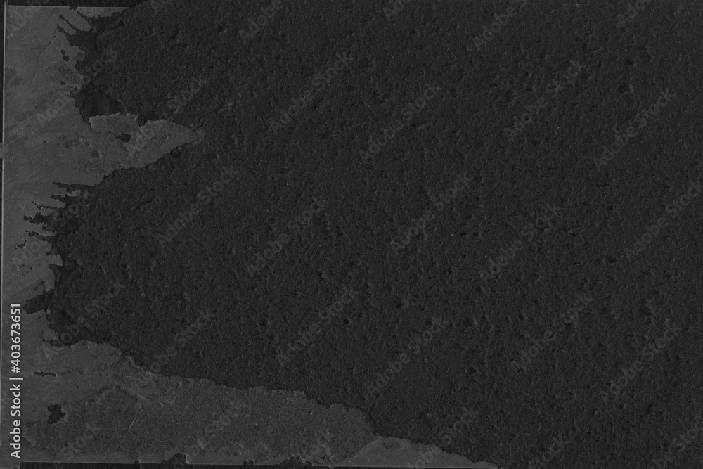 Naklejka premium Cardboard black abstract texture close-up. Dark old paper background. Grunge concrete wall. Vintage blank wallpaper.