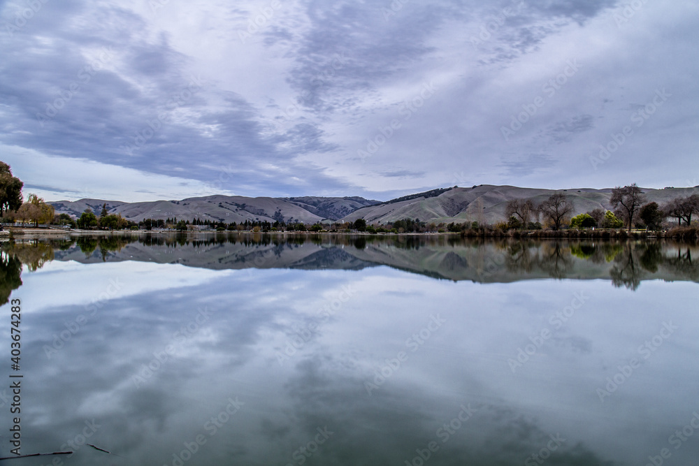 Suburban Landscape Reflected Through Lake