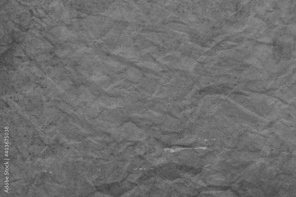 Naklejka premium Cardboard black abstract texture close-up. Dark old paper background. Grunge concrete wall. Vintage blank wallpaper.