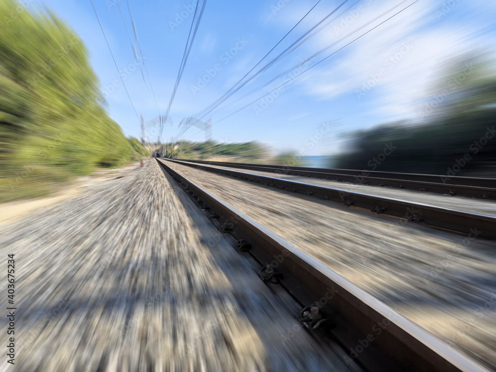 Fast moving blurred effect on train tracks 