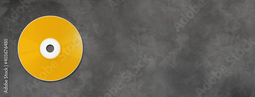 Yellow CD - DVD mockup template isolated on concrete background banner