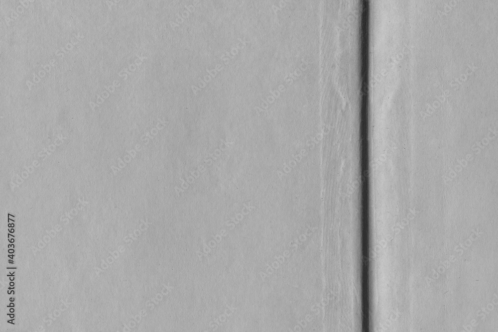 Fototapeta premium Cardboard black abstract texture close-up. Dark old paper background. Grunge concrete wall. Vintage blank wallpaper.