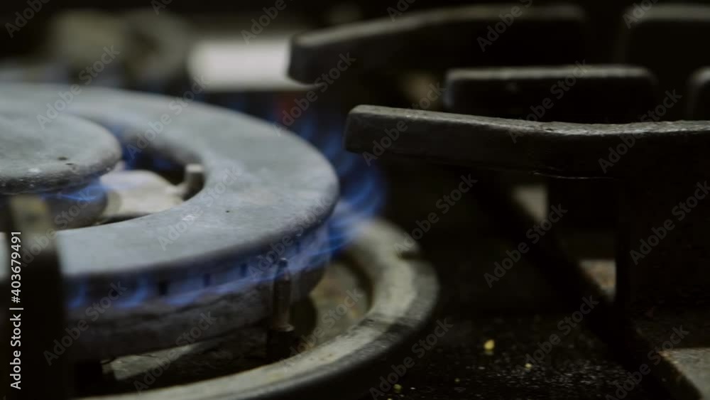 Flame Gas Burner Operation, Fire on the Stove. Gas Ignition. Gas is lit, Gas Burner on the Kitchen Stove, Close-up. Slow-motion Flame Gas Burner Operation, Fire on the Stove. Gas Ignition. Gas is lit, Gas Burner on the Kitchen Stove, Close-up. Slow-motion