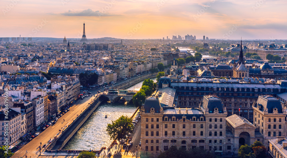 Panoramic aerial view of Paris, Eiffel Tower and La Defense business district. Aerial view of Paris at sunset. Panoramic view of Paris skyline with Eiffel Tower and La Defense. Paris, France. - obrazy, fototapety, plakaty 