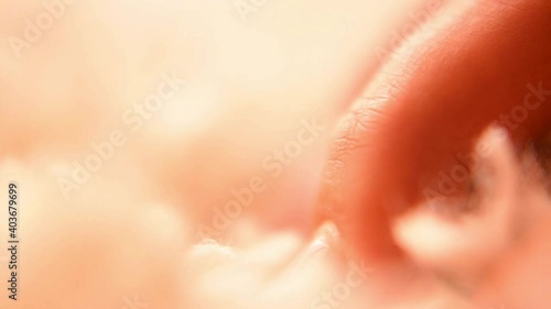 Macro. Close-up of the girl's fingers crawling on the carpet