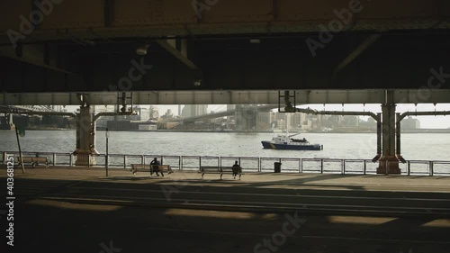 Driving under bridge by water