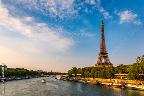 Paris Eiffel Tower and river Seine at sunset in Paris, France. Eiffel Tower is one of the most iconic landmarks of Paris. Eiffel tower in summer, Paris, France. The Eiffel Tower in Paris, France.