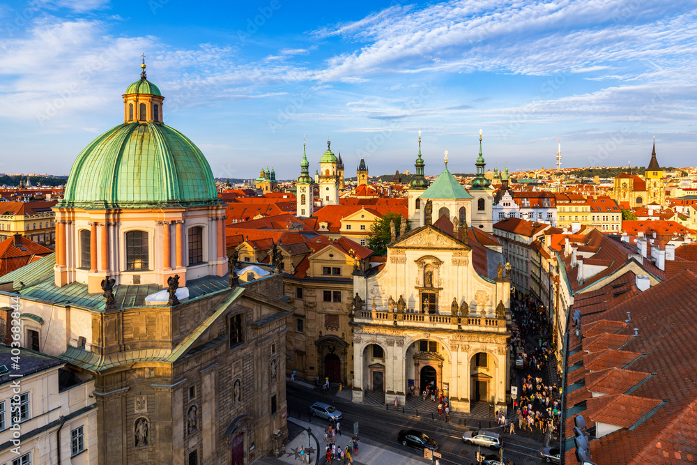 Scenic summer aerial panorama of the Old Town architecture in Prague, Czech Republic. Red roof tiles panorama of Prague old town.  Prague Old Town Square houses with traditional red roofs. Czechia.